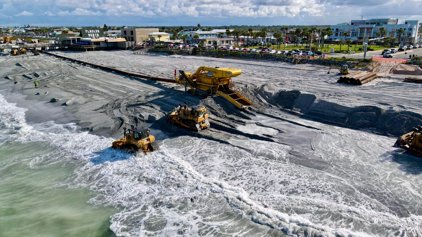 Coastal Florida infrastructure work with heavy machinery on Flagler Beach, representative of the SUNRISE Project construction phase